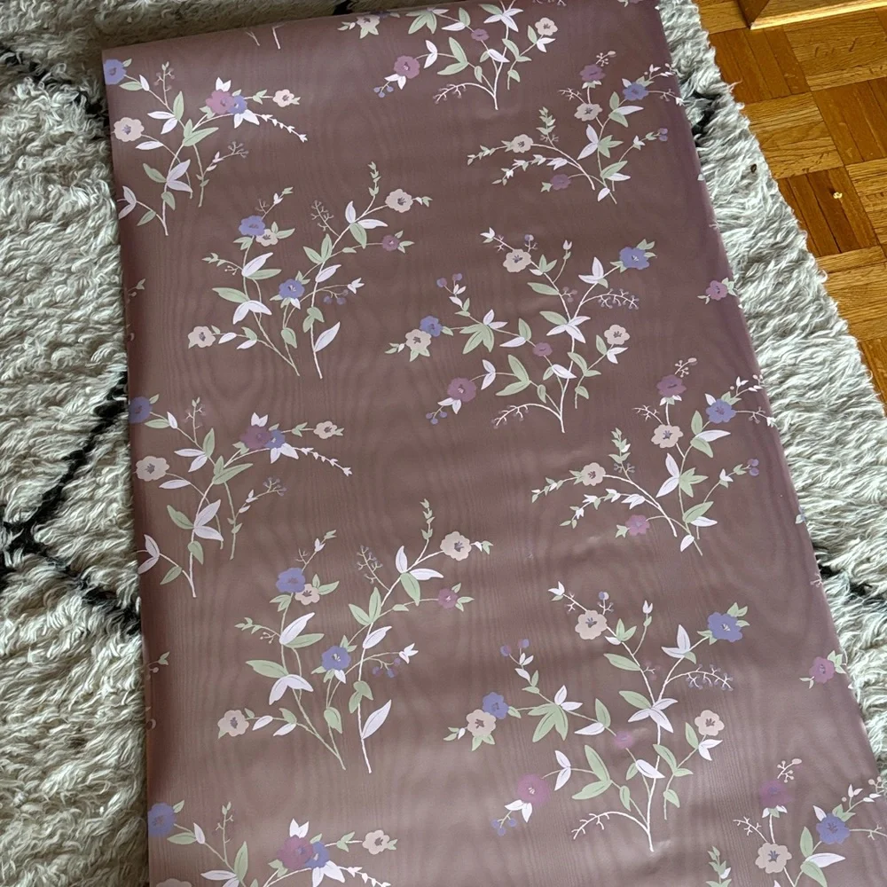 Vintage wallpaper Floral Patterned with a shiny mauve pinkish purple background